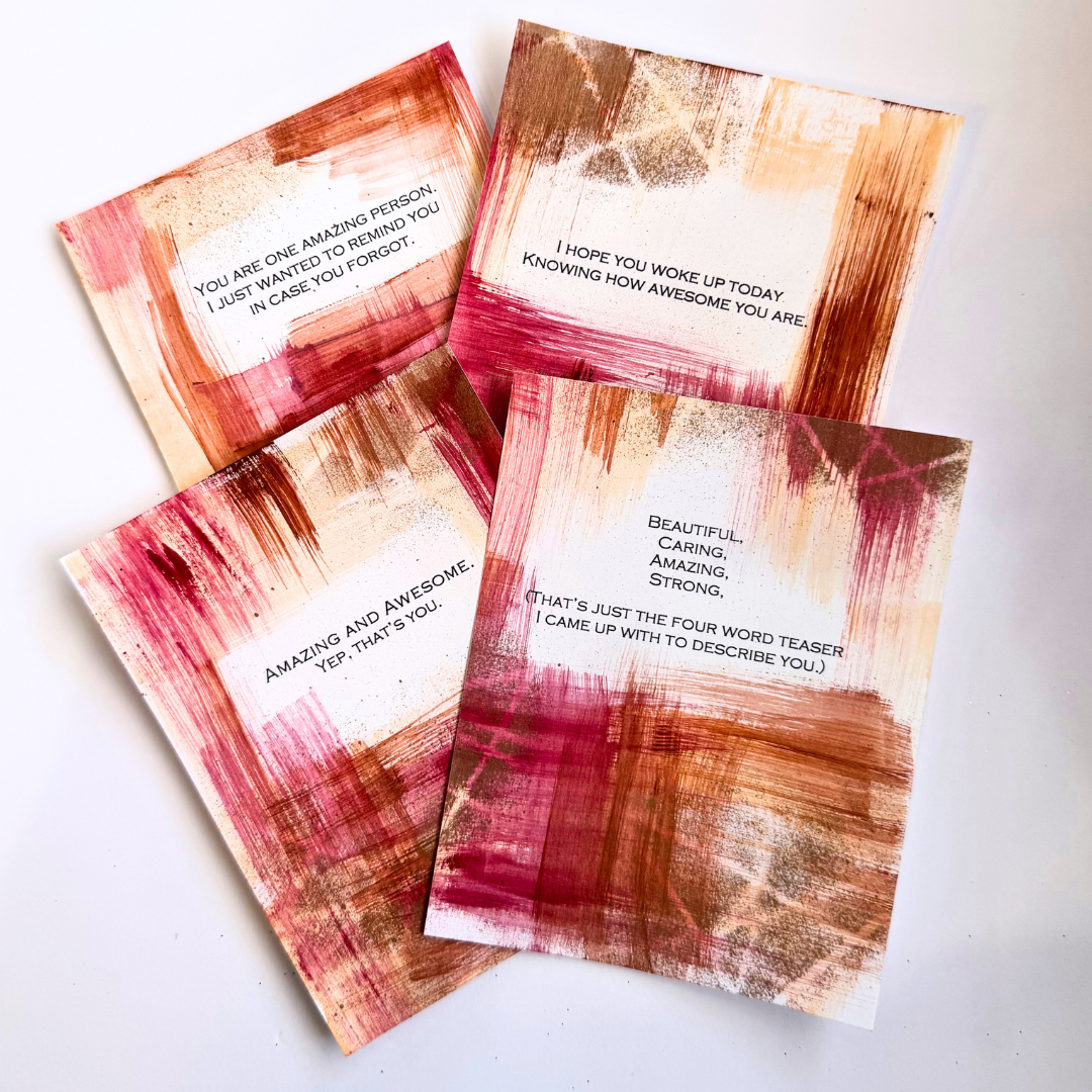 Good Vibes Snail Mail “The Amazing Pack” featuring four handpainted encouragement cards with uplifting quotes, wrapped with a glitter band and heart sticker, designed to brighten mailboxes and send meaningful handwritten connection.