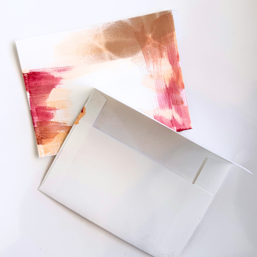 Good Vibes Snail Mail “The Amazing Pack” featuring four handpainted encouragement cards with uplifting quotes, wrapped with a glitter band and heart sticker, designed to brighten mailboxes and send meaningful handwritten connection.