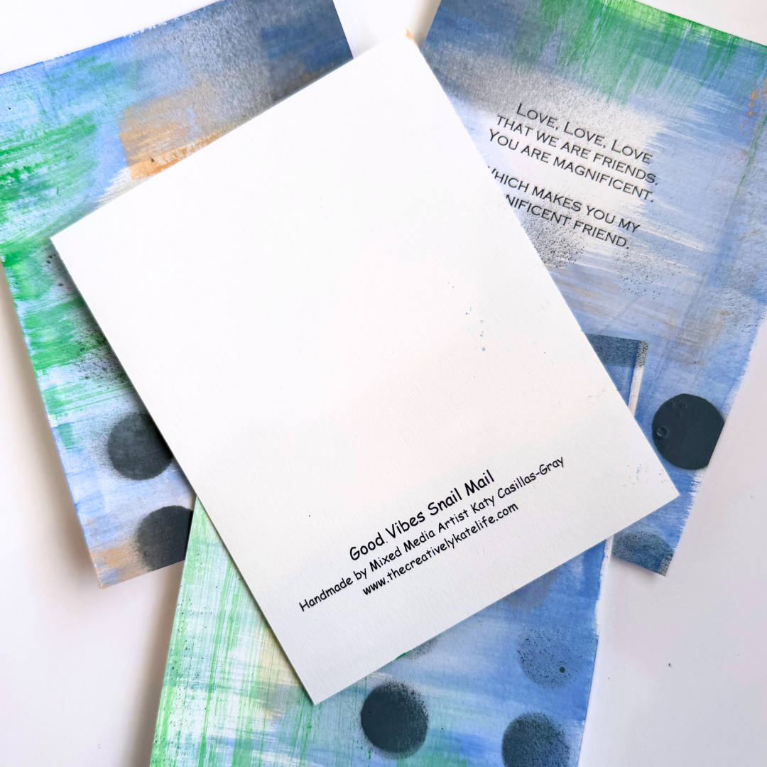 Good Vibes Snail Mail “The Magnificent Pack” featuring four handpainted encouragement cards with uplifting quotes, wrapped with a glitter band and heart sticker, created to brighten mailboxes and foster meaningful handwritten connection.