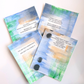 Good Vibes Snail Mail “The Magnificent Pack” featuring four handpainted encouragement cards with uplifting quotes, wrapped with a glitter band and heart sticker, created to brighten mailboxes and foster meaningful handwritten connection.