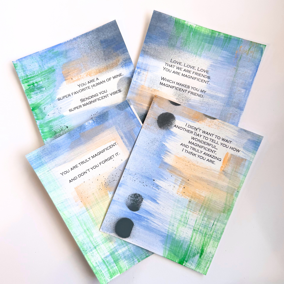 Good Vibes Snail Mail “The Magnificent Pack” featuring four handpainted encouragement cards with uplifting quotes, wrapped with a glitter band and heart sticker, created to brighten mailboxes and foster meaningful handwritten connection.