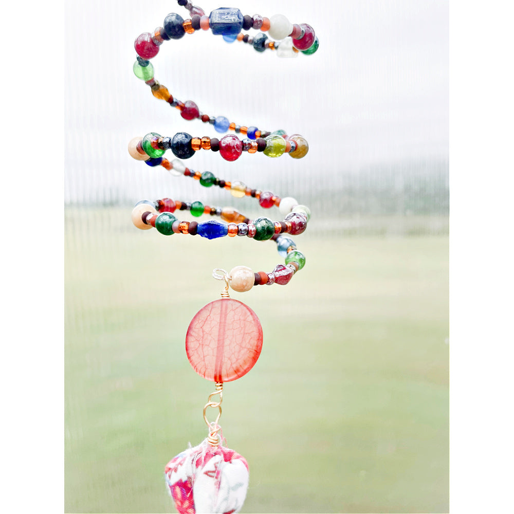 "Boho Prism: Multicolor Beaded Suncatcher with Fabric Tassel"