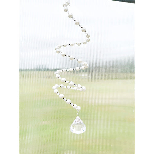 Pearlescent Radiance: Pearl and Crystal Slinky Window Hanging