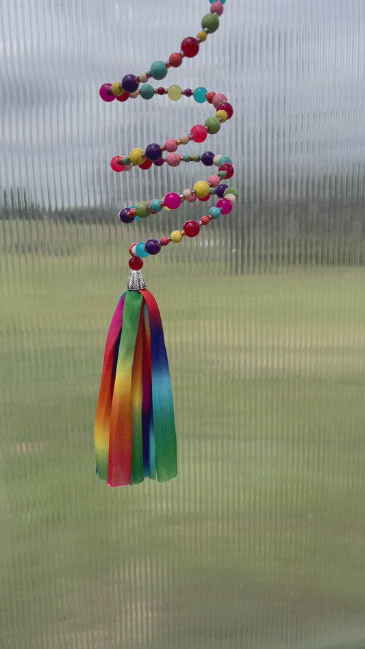 Rainbow Delight: Beaded Slinky Window Decor with Colorful Tassel