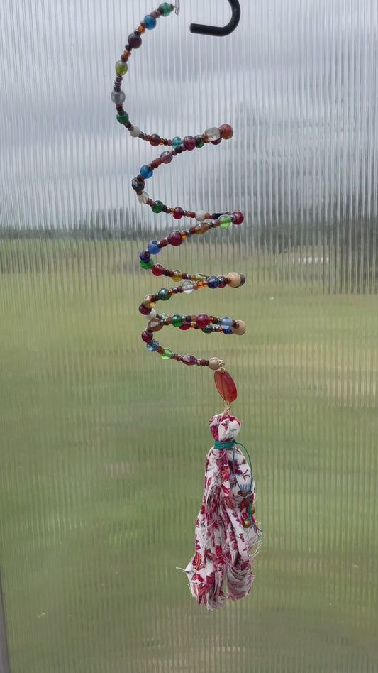 "Boho Prism: Multicolor Beaded Suncatcher with Fabric Tassel"